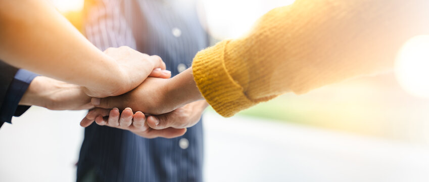 Panoramic teamwork business join hand together,Teamwork power,unity concept.group of friends put their hands together.Volunteer charity work.People joining for cooperation success business.