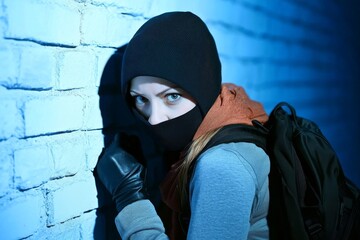 Intriguing Burglar in Hiding, Anxious to Commit Theft in a Residence