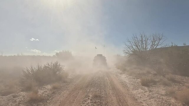 Recreation very dusty trail mountain desert UTV Utah POV. Off road trail riding in 4x4 all terrain vehicle for sport and recreation. Desert landscape, dusty trails and recreation areas. Southwest Utah