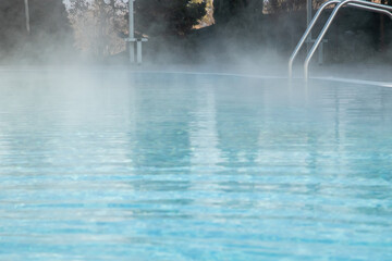 Detail of hotel outdoor pool with hot mineral water vapors