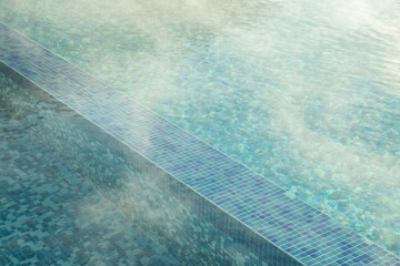 Detail of hotel outdoor pool with hot mineral water vapors