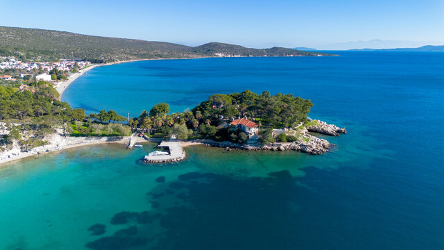 Manal Bay, which is connected to İzmir, is a peaceful and quiet resting area with its deep blue sea in Mordoğan Karaburun. Aerial view with drone. Izmir - Turkey