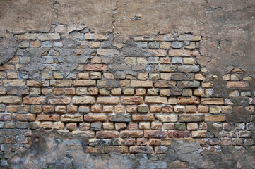 brick wall, in the photo the texture of the old brick wall and plaster