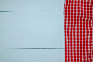 Fototapeta premium Red checkered tablecloth on the table