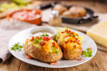 baked potatoes stuffed with cheese and bacon