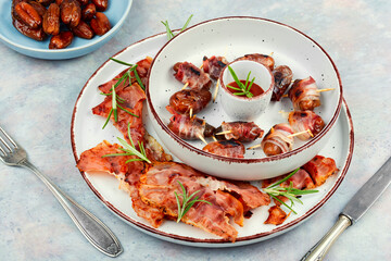 Italian bacon wrapped dates appetizer.