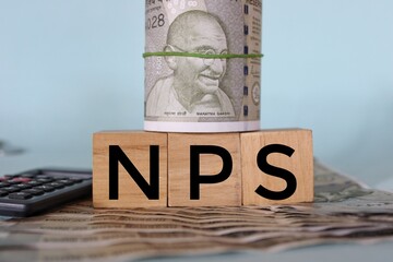 NPS or national pension scheme with wooden bids or blocks.
