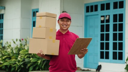 Happy Courier with Box Smiling Outdoors. Delivery Man Preparing for Package Drop-Off with Clipboard. Delivery service, smiling courier, package delivery, outdoor logistics, distribution process