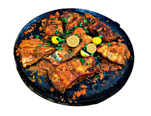 Fish Pieces Frying in a Pan on White Background
