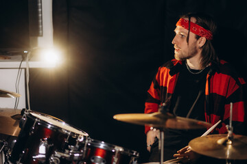 Young Drummer Playing Percussion in Studio With Focus and Passion