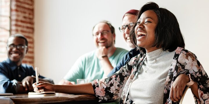 Diverse team enjoying work laughter