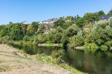 View of the Ruhr river and the surrounding green landscape. Nature on the river near Hattingen in the Ruhr area, Germany.