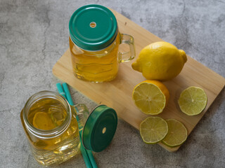 preparation of refreshing tea drink with lemon. fresh fruit