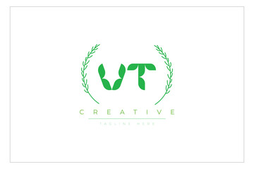 VT letters eco logo with leaf. Fresh nature and healthy leaf logo design.