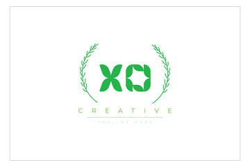 XO letters eco logo with leaf. Fresh nature and healthy leaf logo design.