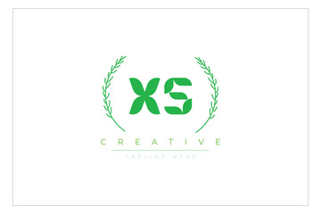 XS letters eco logo with leaf. Fresh nature and healthy leaf logo design.