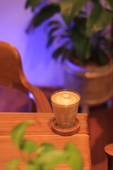Latte Art Heart Design Enhances Coffee Experience Beautifully in Cozy Cafe with Plants