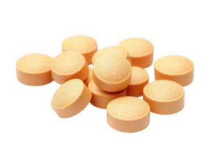 Chewable orange tablets stacked on transparency background, ideal for health and wellness concepts. These tablets are often used for dietary supplements or vitamins