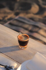 Coffee Sits on Table Outdoors Elegantly at Sunset Tranquilly