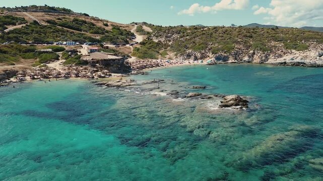 Amazing view of Sithonia coastline near Tigania Beach, Halkidiki in Greece. Coastline of Greek beach view and people on vacation.