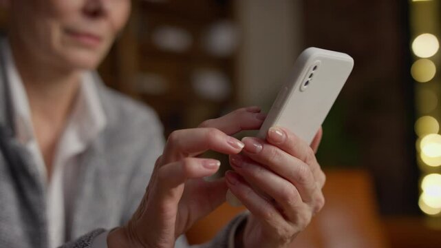 Close-Up of Senior Woman Using Smartphone