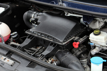 Close up diesel engine. Engine air filter cover. Engine close-up of a cargo van. Diesel engine parts.