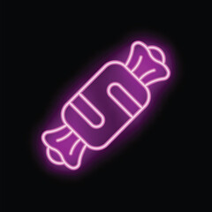Neon sign of wrapped candy glowing pink against a black background