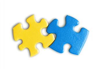 Obraz premium Photo of yellow and blue puzzle pieces on a white background, depicting a tangent line between them. The concept is classroom education with a focus on intelligence symbolized by geometric shapes