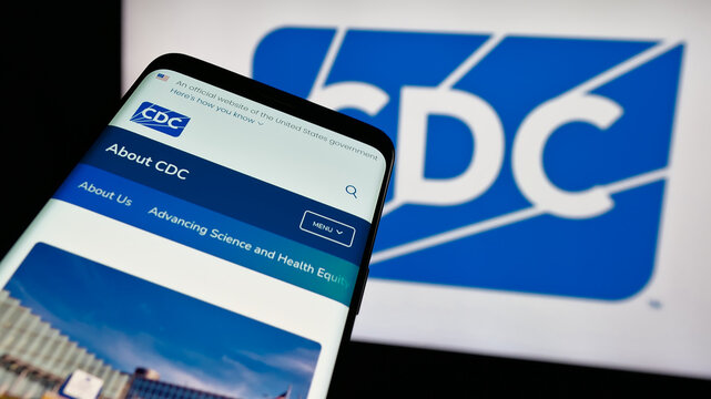 Stuttgart, Germany - 01-28-2025: Mobile phone with website of Centers for Disease Control and Prevention (CDC) on screen in front of logo. Focus on top-left of phone display.