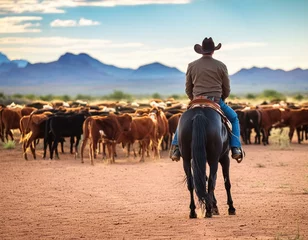 Fototapete Horse riding cowboy in Arizona type of landscape driving cattle herd. AI generated image. © Tupungato