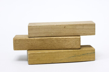 Three wooden block on white background