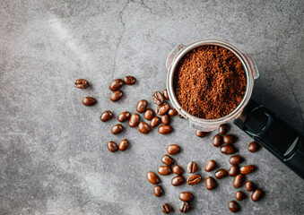 Ground coffee in portafilter filled ready for brewing espresso, Top view