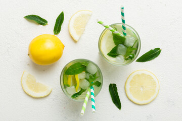Caipirinha, Mojito cocktail, vodka or soda drink with lime, mint and straw on table background....