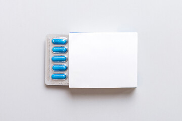 Blank White Product Package Box Mock-up. Open blank medicine drug box with blue pills blister top...