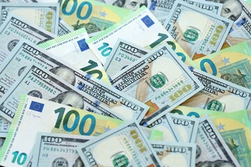 Big pile of Euro and USD banknotes. Many european and united states dollars
