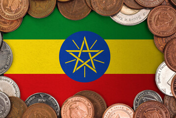 Coins on flag of Ethiopia . trading investment business currency concept