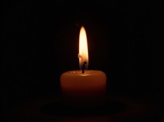 Single Candle Flame in Dark, Dramatic Lighting