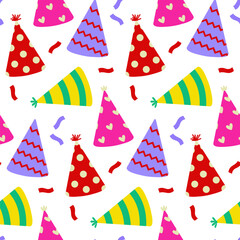 Obraz premium Colorful party hats scattered on a white background for festive celebrations