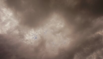 The afternoon sky is brown and cloudy, perfect for a background
