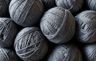 A pile of gray yarn balls on a white background