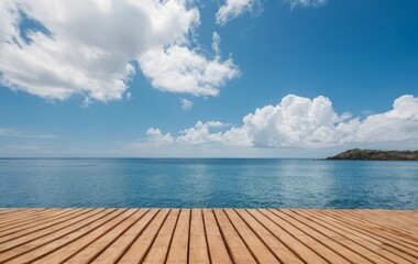 Fototapeta premium A wooden berth extending into a clear blue ocean with a beautiful sky above