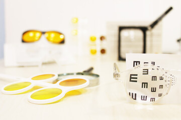 Magnifying glass in the central part, on the right vision test through a square black magnifying...