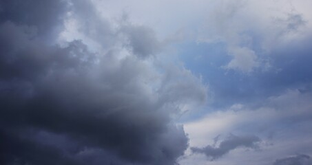 The afternoon sky is cloudy with black clouds, a sign of rain, suitable for your background