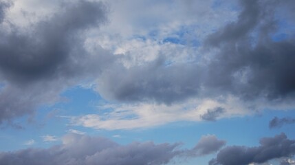 the afternoon sky is cloudy with black clouds, a sign that it will rain