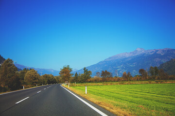 Fototapeta premium View of a beautiful mountain landscape through a windscreen on a sunny day