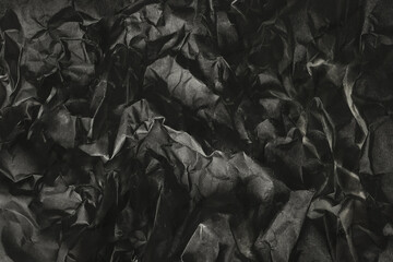 Abstract dark gray crumpled paper texture background