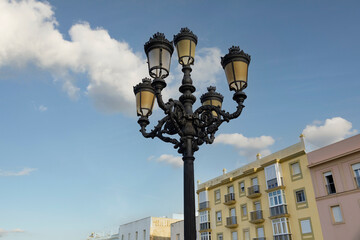 ornate art deco black Cast iron street lights in the Spanish city of Cadiz.