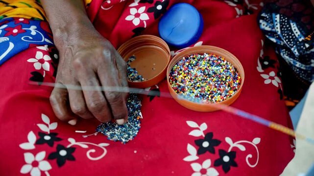 African artist handcrafting Maasai jewelry