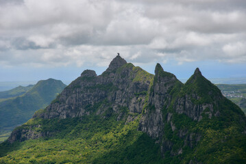 Peter Both Mountain, one of Mauritius' most distinctive peaks, offers a breathtaking aerial view that showcases its dramatic rock formations and lush surroundings