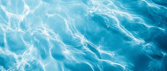 Sunlight reflecting on blue water surface